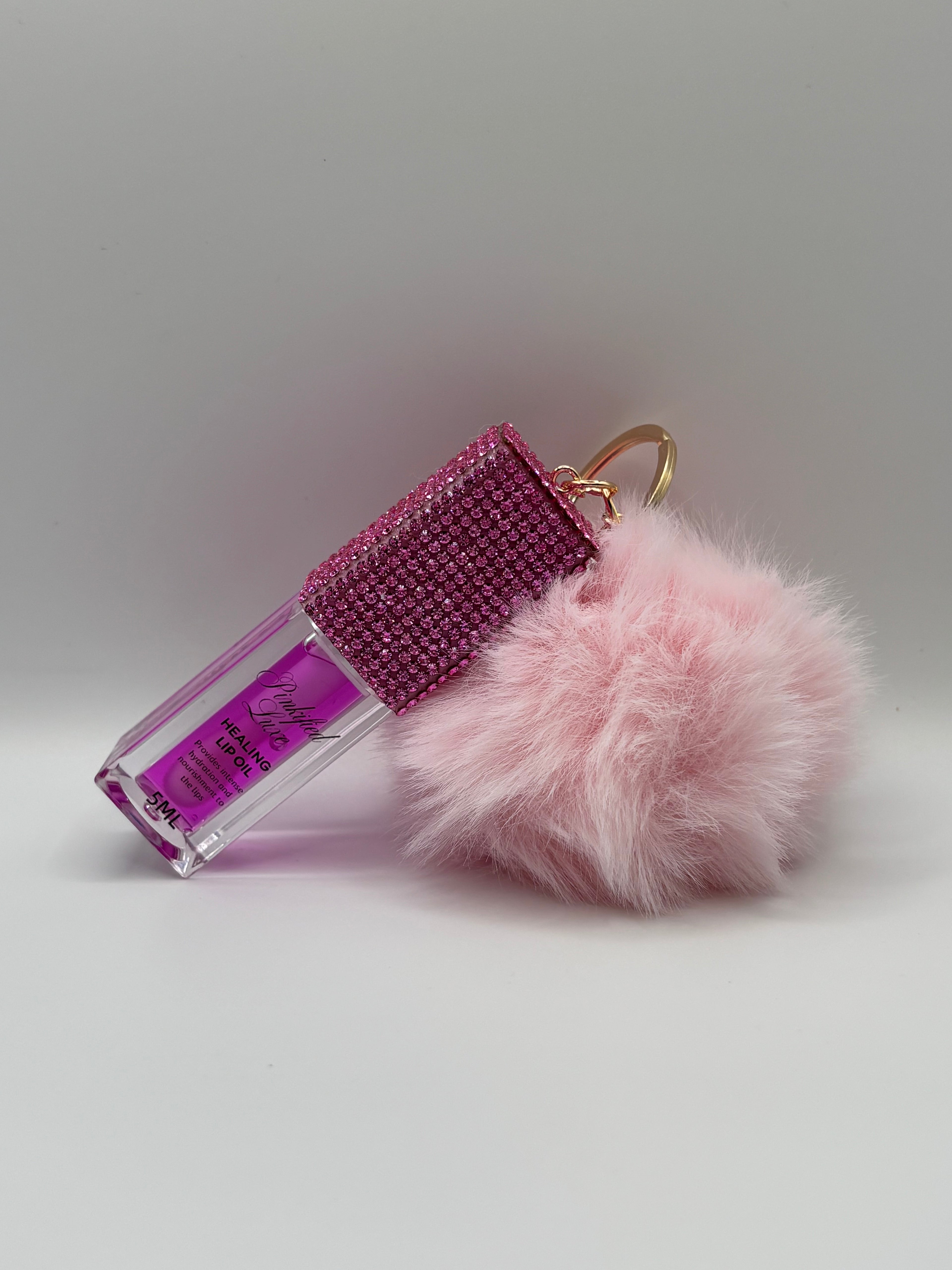 Cherry bling lip oil with pink puff