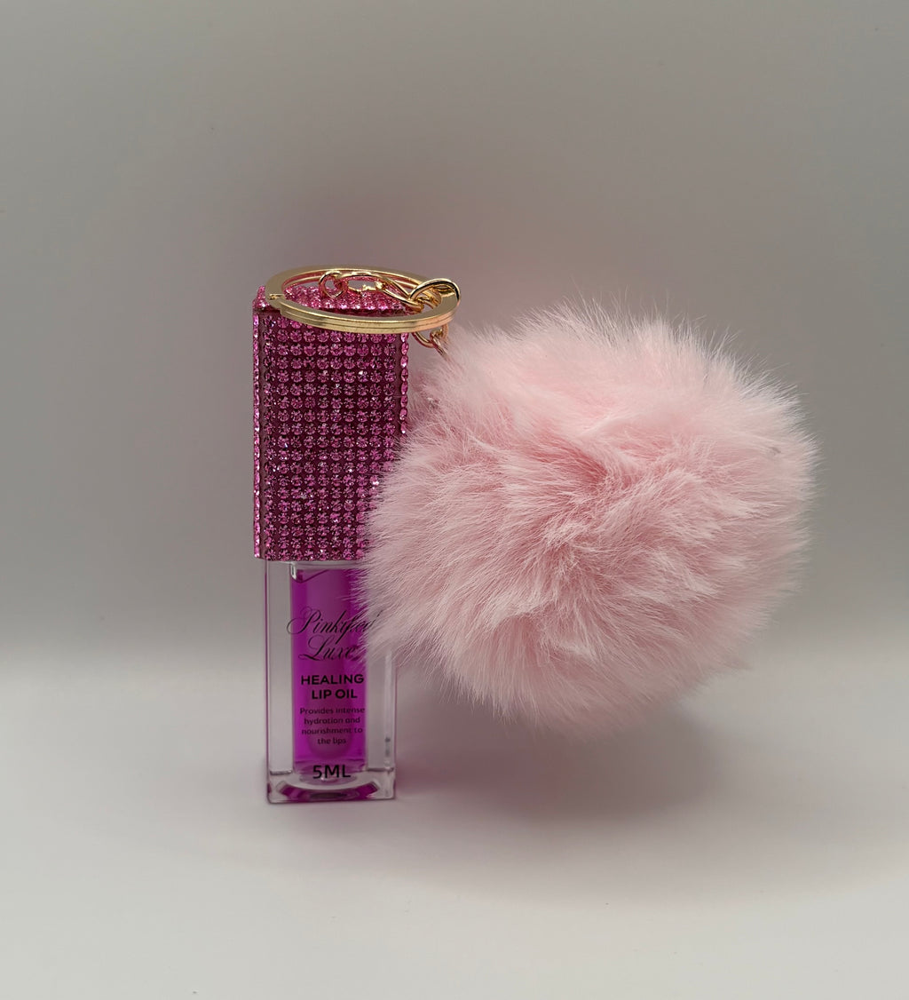 Cherry bling lip oil with pink puff