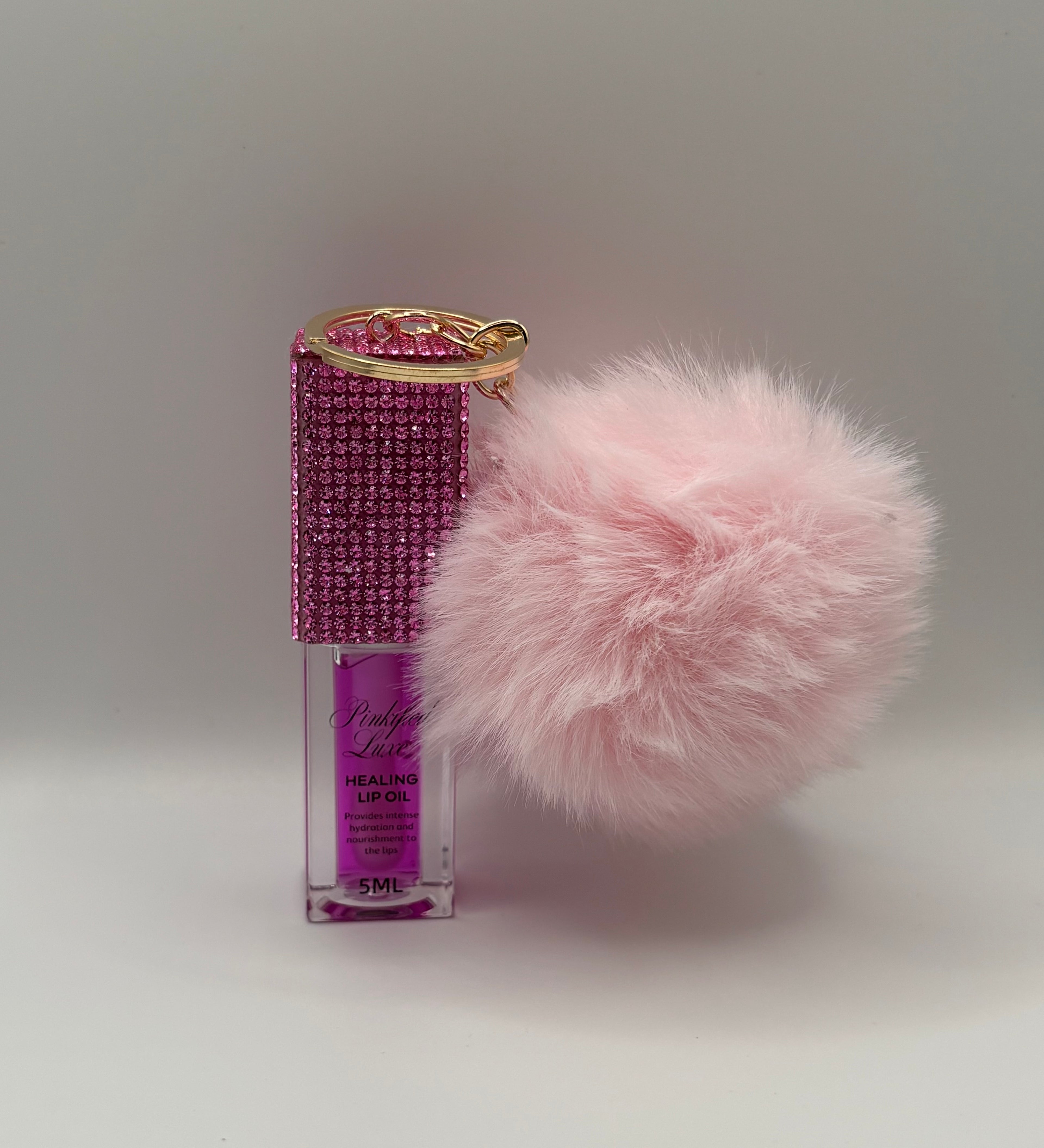 Cherry bling lip oil with pink puff